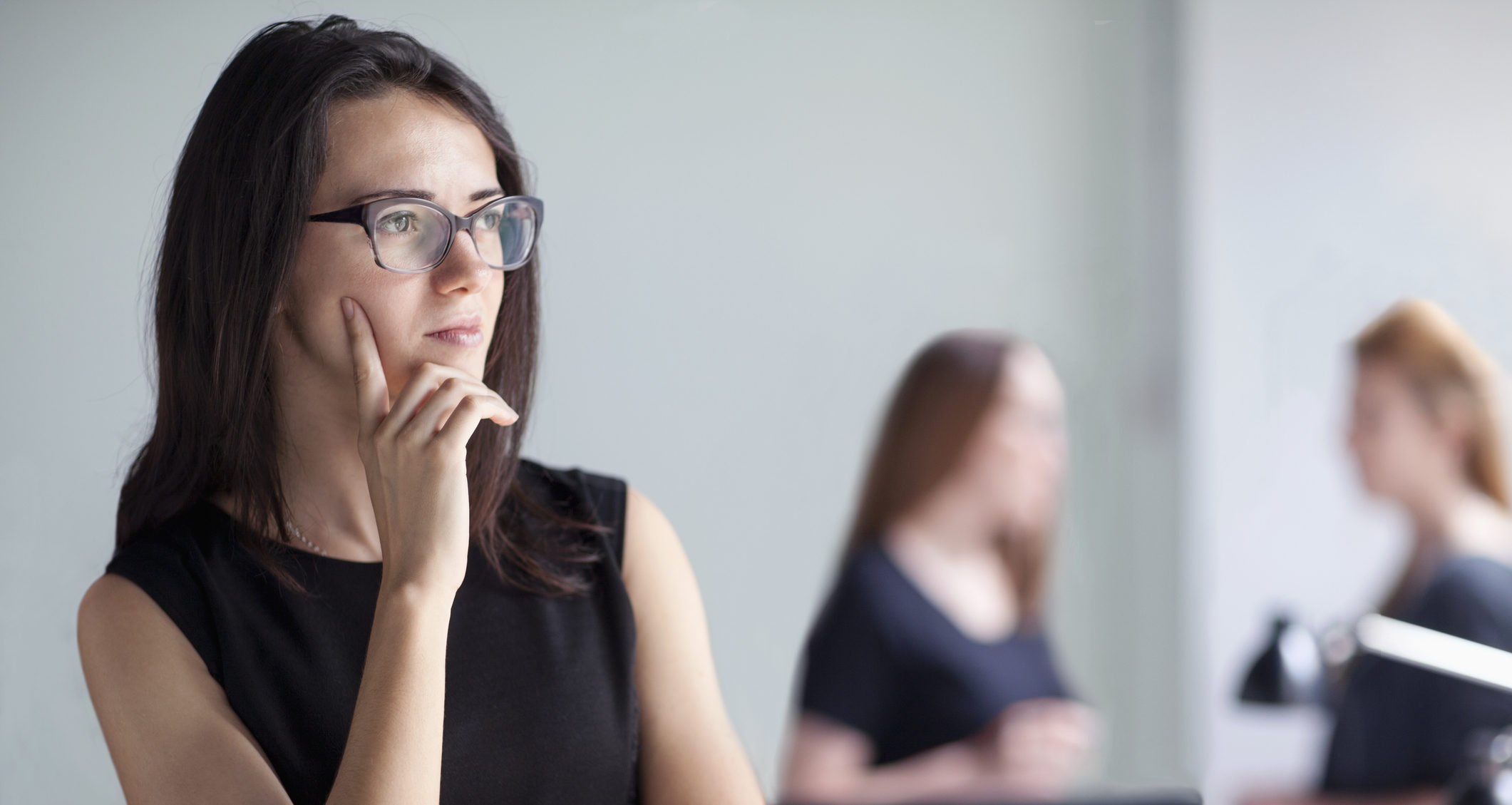 Young woman thinking in business office