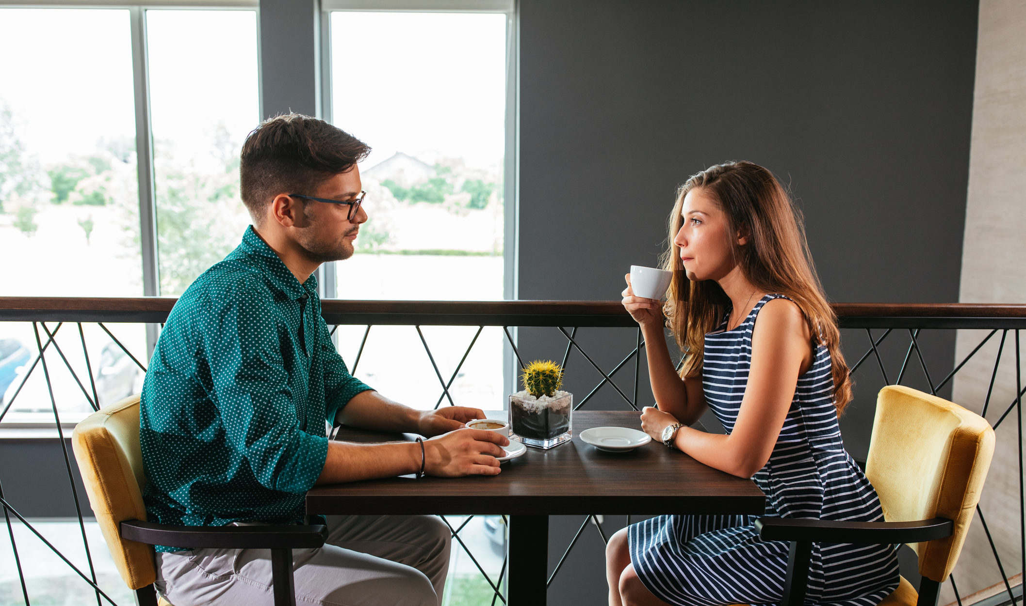 Shot of a couple having a conversation over coffee at the restaurant