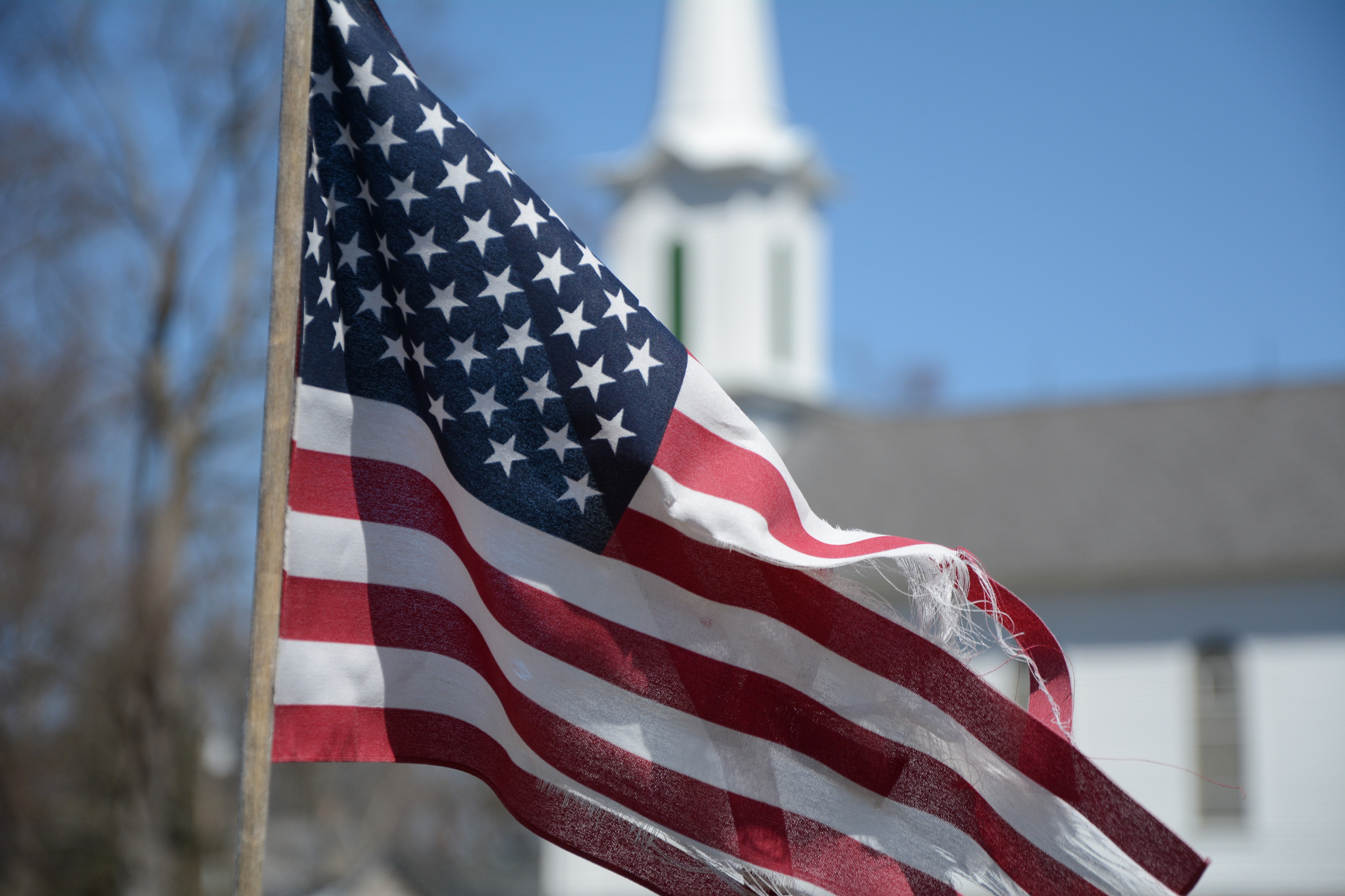 Americas flag Old Glory flies freely in a Country Churchyard in Hope New Jersey