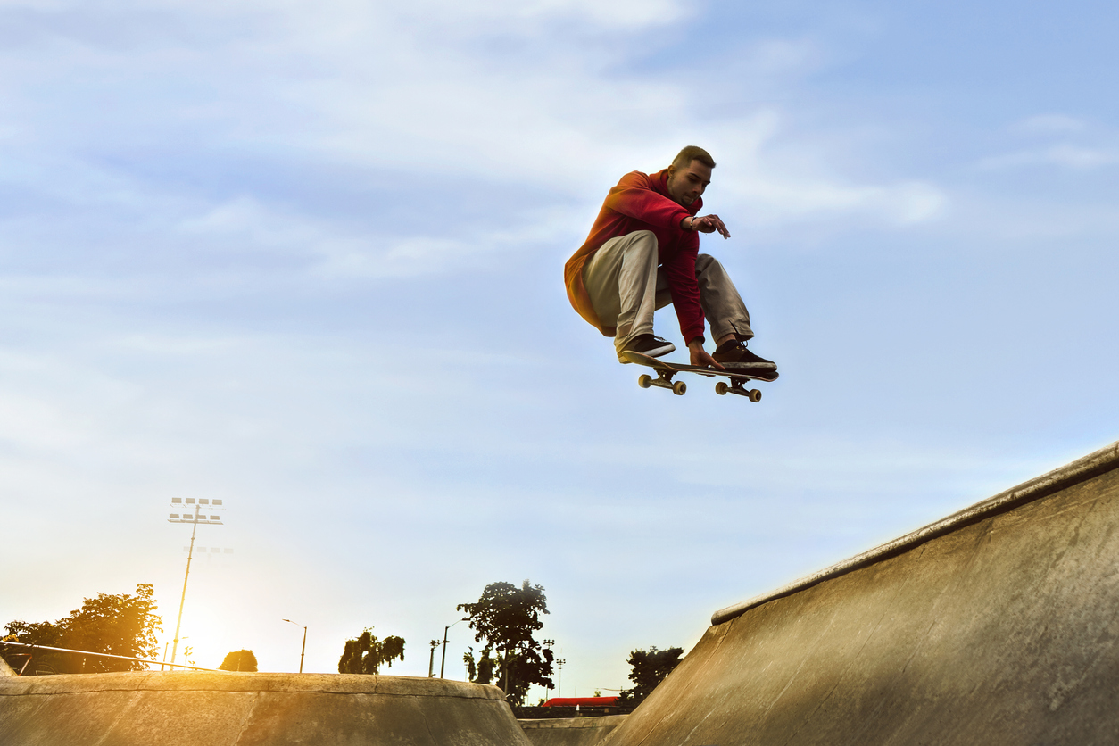 Happy young skateboarders having fun in a skatepark