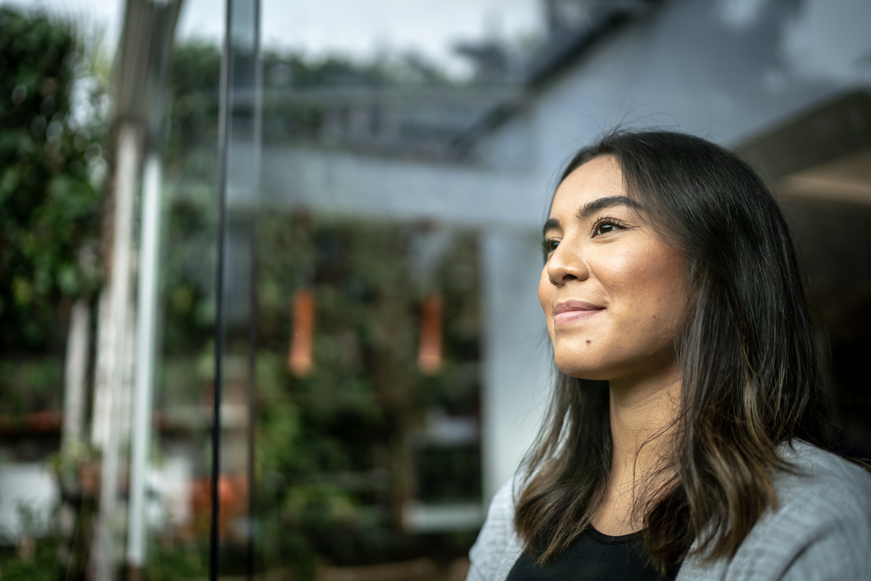 Young woman contemplating at home
