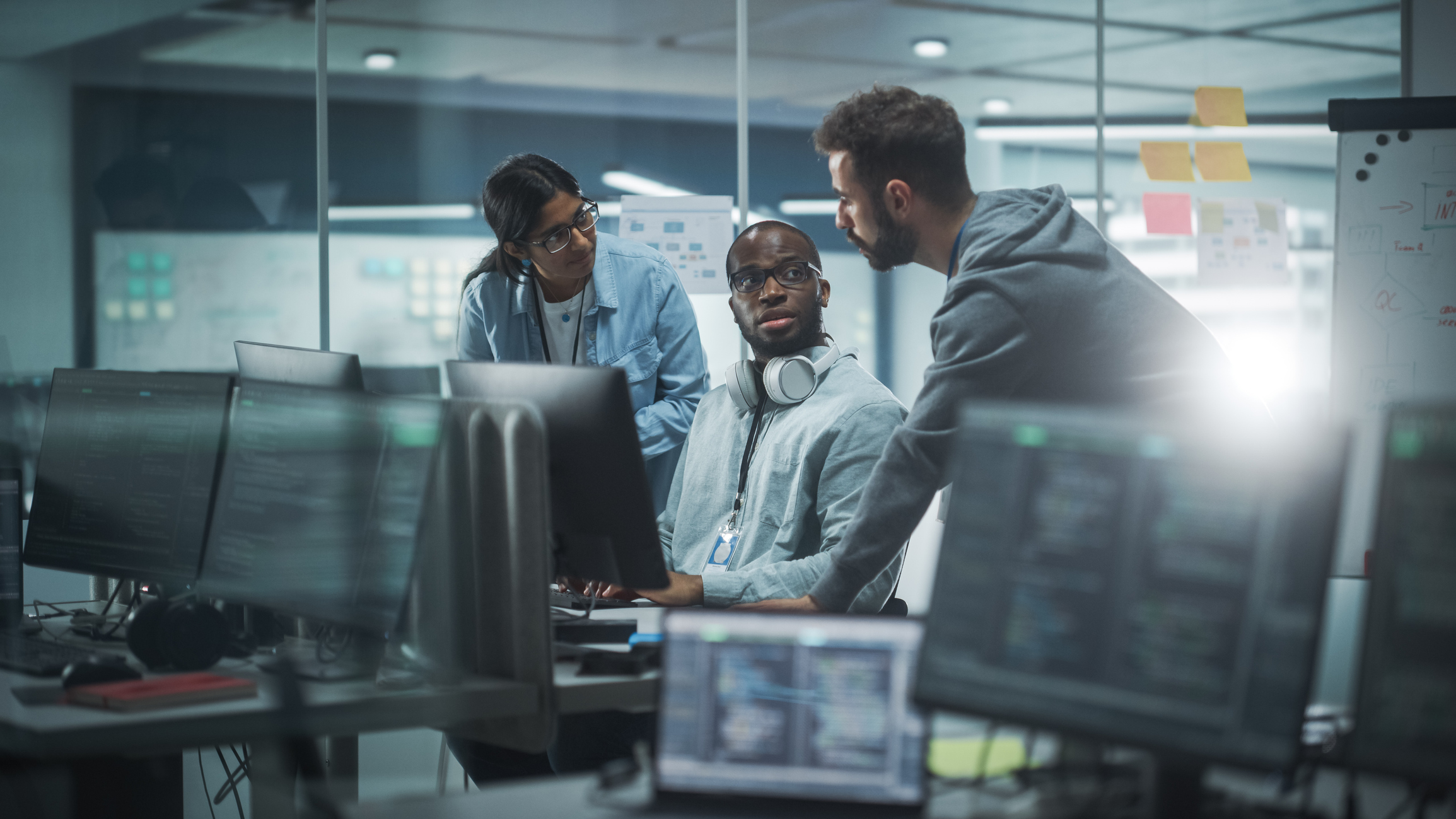 Diverse group of professionals meeting in modern office