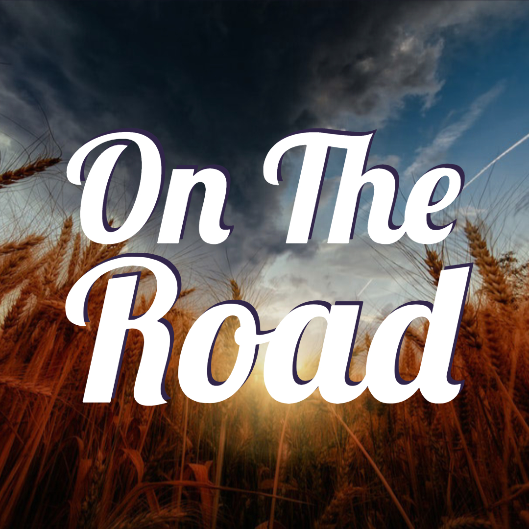 The inscription 'On the Road' on a grain background