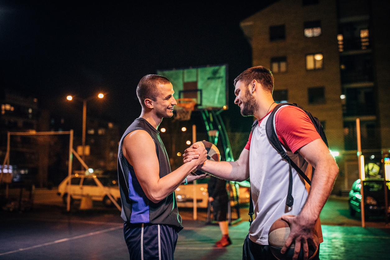 Streetball friends handshake after game