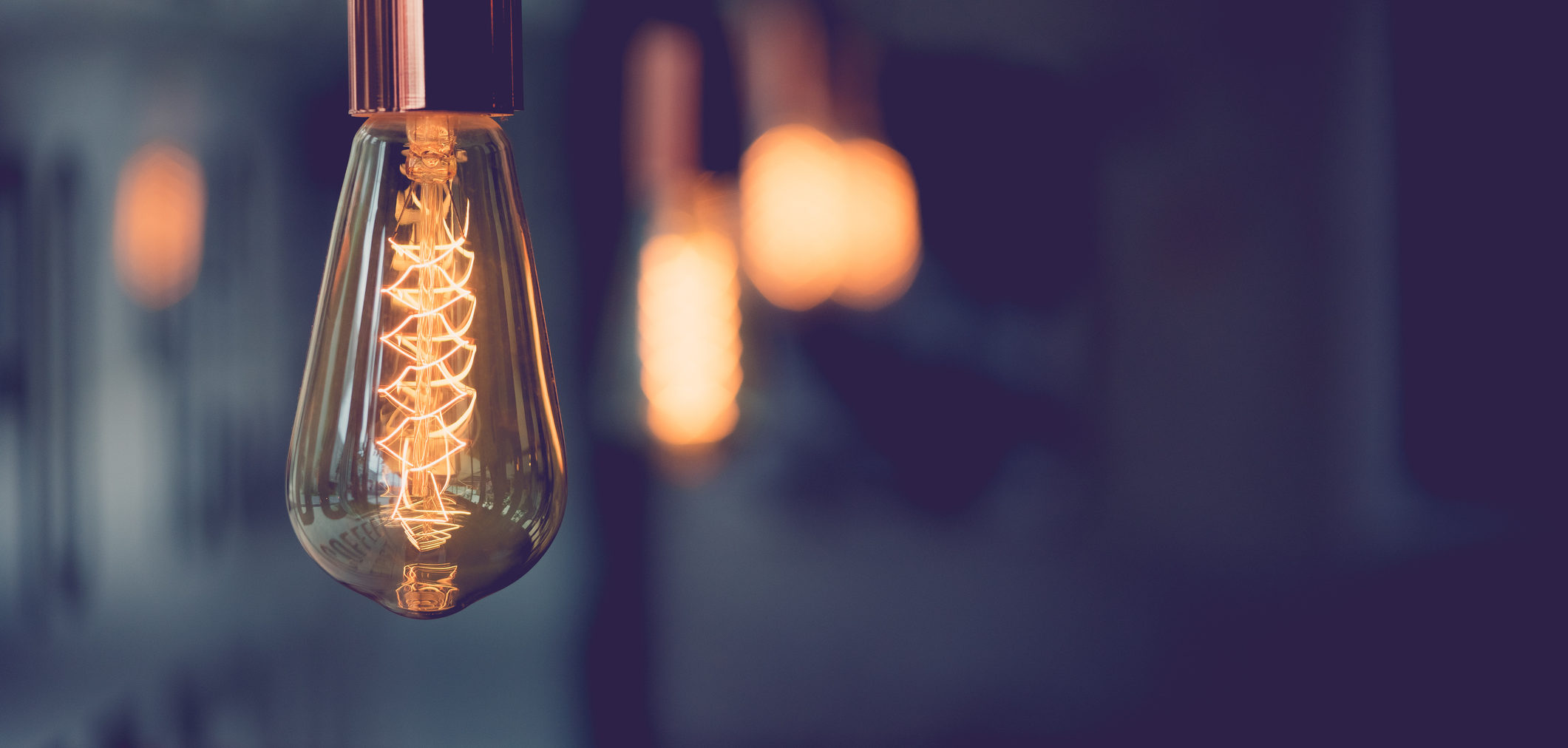 Vintage electric light.Decorative antique edison style light bulbs in coffee shop.vintage tone