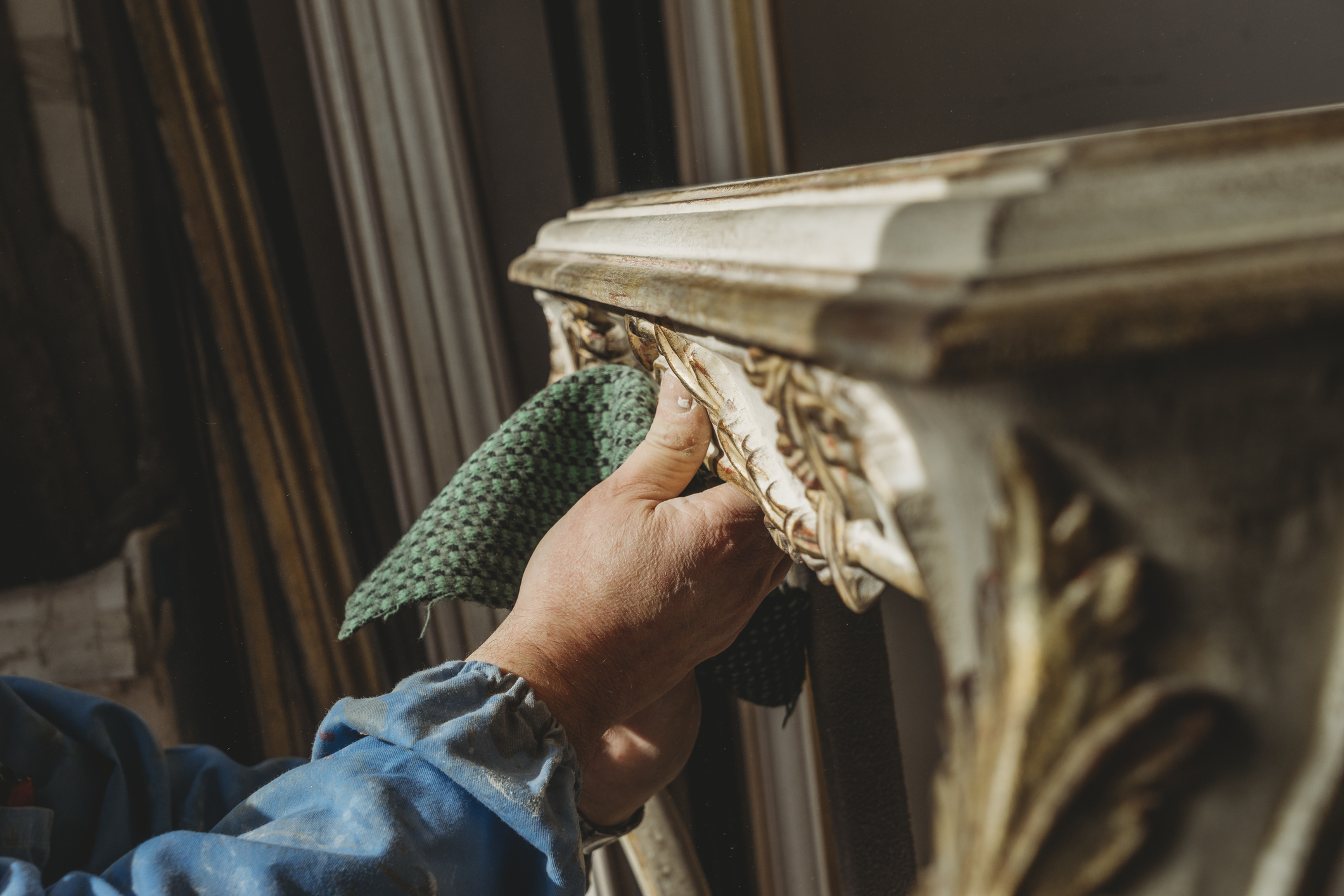 Carpenter polishing a restored table