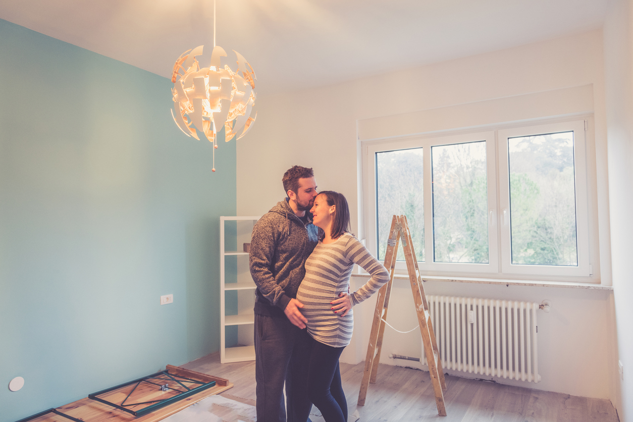 Happy couple in the new baby room