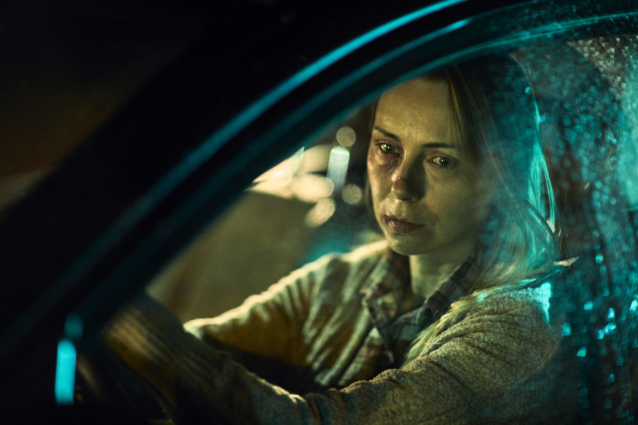 Injured woman driving a car