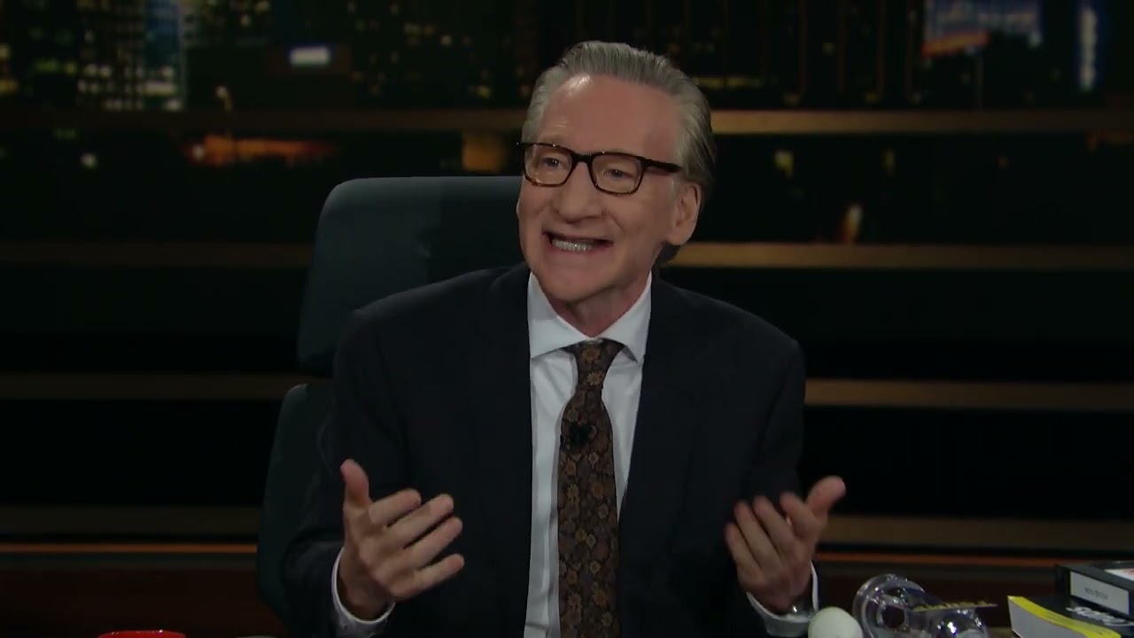 Elderly man in a suit and glasses