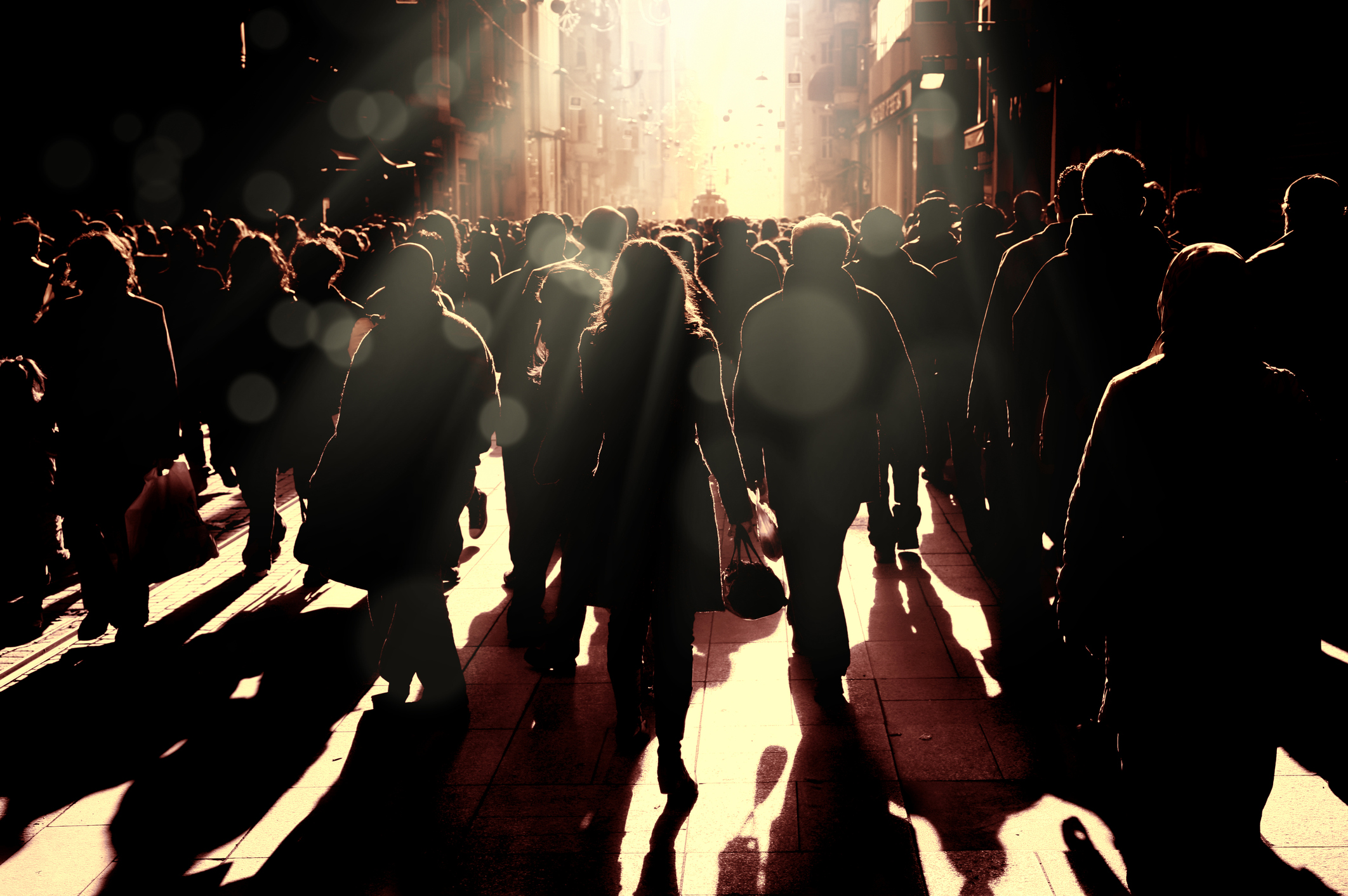 Close up image of crowded people walking on busy street in Istanbul