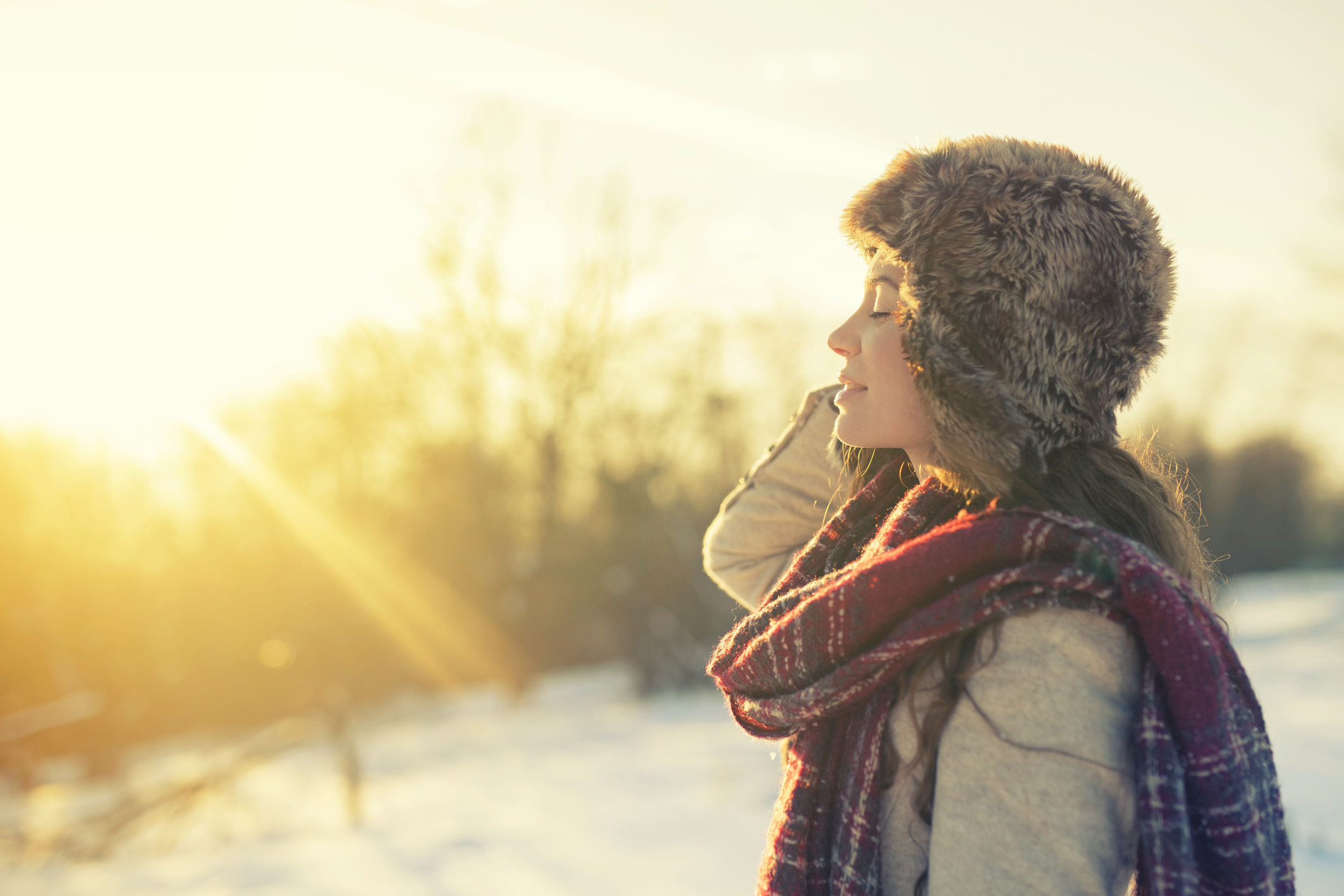 Woman soaking in the sun on a winter day