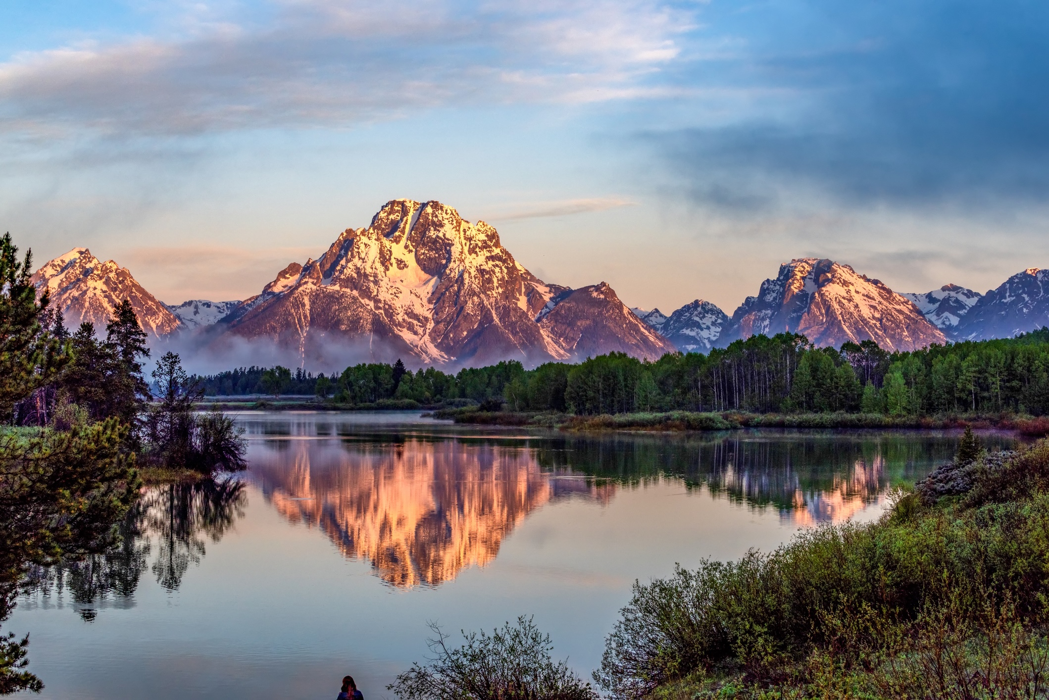 Grand teton national park, Wyoming, USA. A view of the mountain range beyond a crystal clear lake during sunset or sunrise