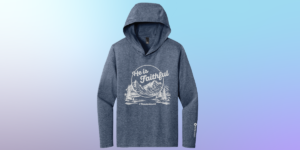 A gray-blue, long-sleeved hoodie with Mountains and the phrase "He is faithful" on the front.