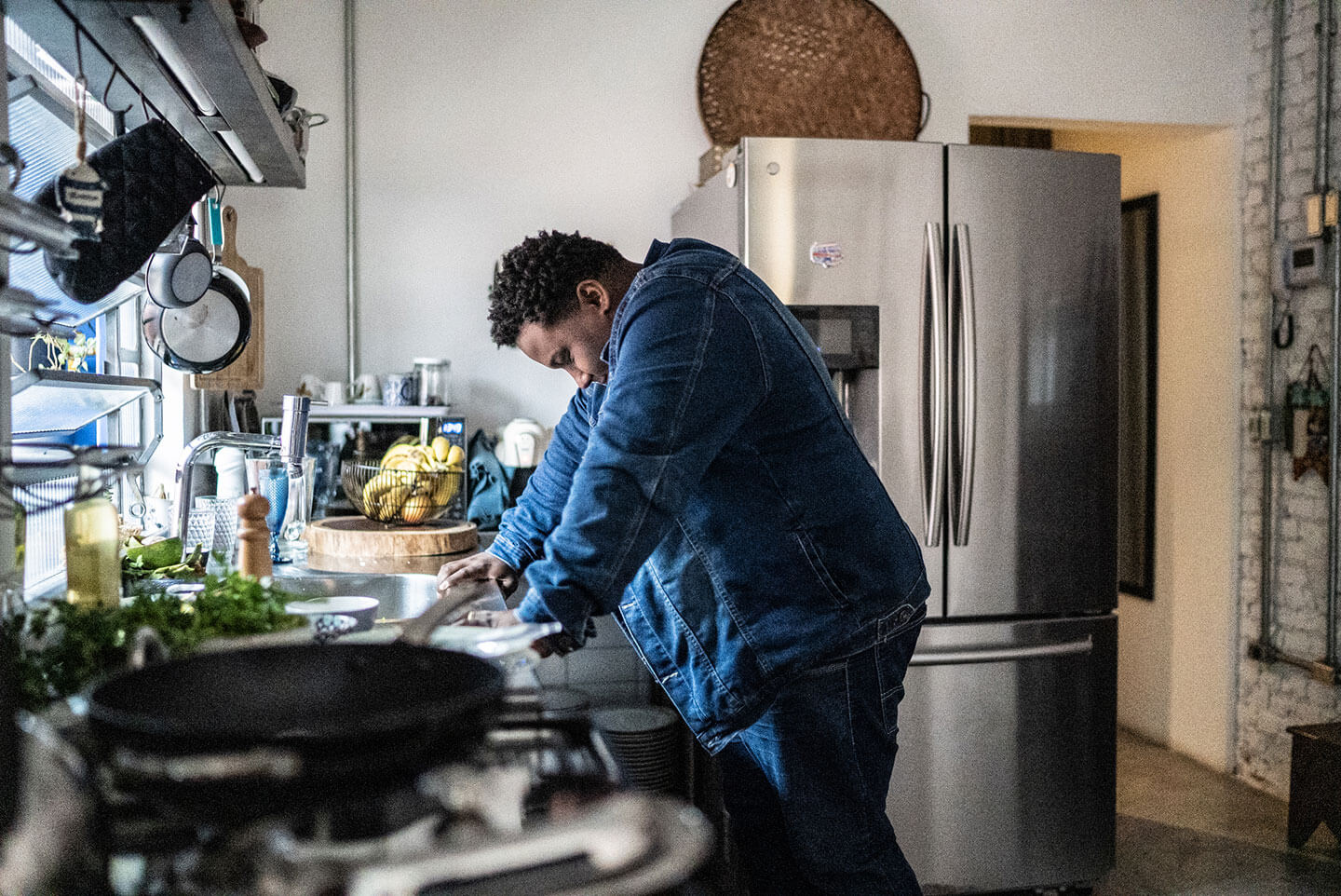 Sad mid adult man in the kitchen